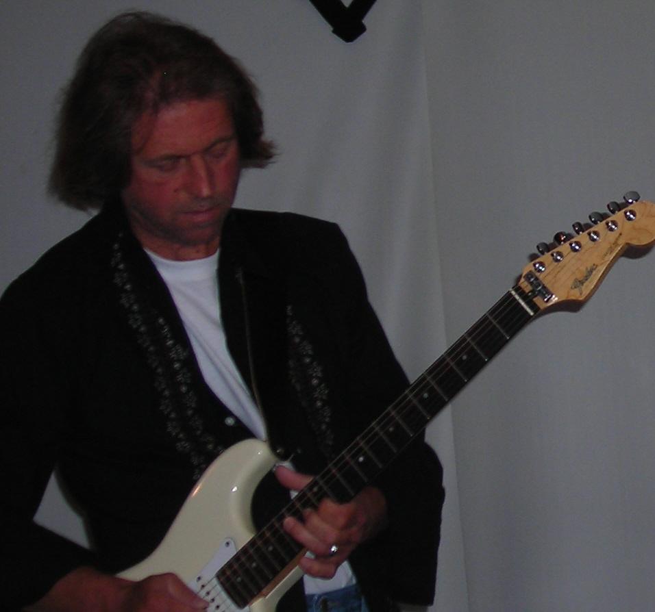 http://indiemusicpeople.com/uploads2/dennis_lore_-_edited_me_guitar.JPG